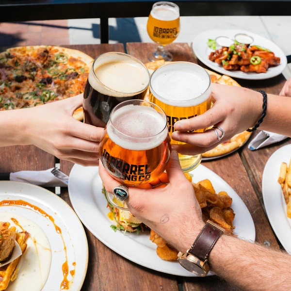 group of friends toasting at dinner